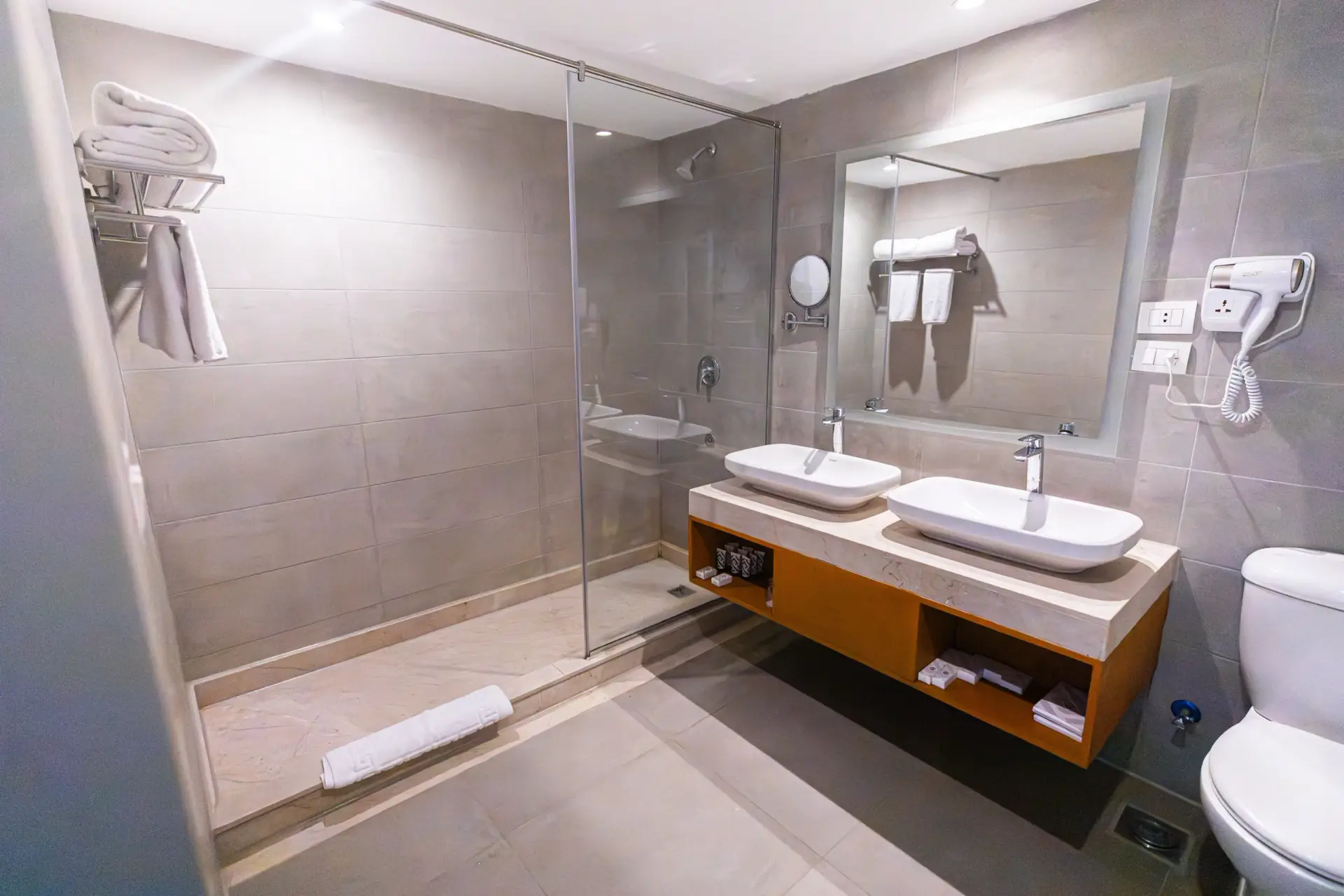 Master Suite bathroom at V Grand Sahl Hasheesh with double vanity, walk-in shower and fresh towels
